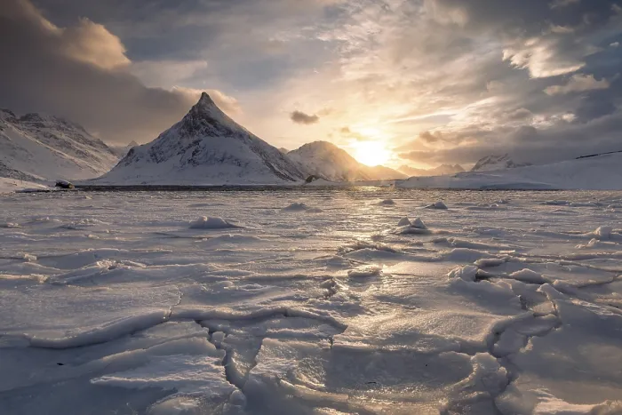 Framed Print : Frozen fjord at sunset, behind mountain Volandstinden Framed Print : Frozen fjord at sunset, behind mountain Volandstinden
