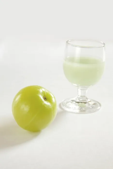 Framed Print : Fruit and drink, Indian Gooseberry Emblica Amla Emblica officinalis with glass of juice wonderful medicine