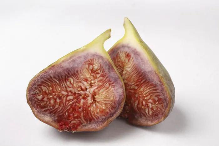Framed Print : Fruit, one Fig Ficus Carica Anjir cut in to two pieces on white background