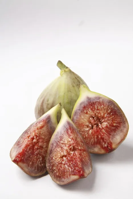 Framed Print : Fruit, Figs Ficus Carica Anjir one full and another cut in three pieces red juicy texture on white background