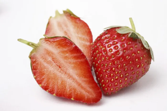 Framed Print : Fruit, Strawberry Fragaria Ananassa one full and two half on white background Framed Print : Fruit, Strawberry Fragaria Ananassa one full and two half on white background