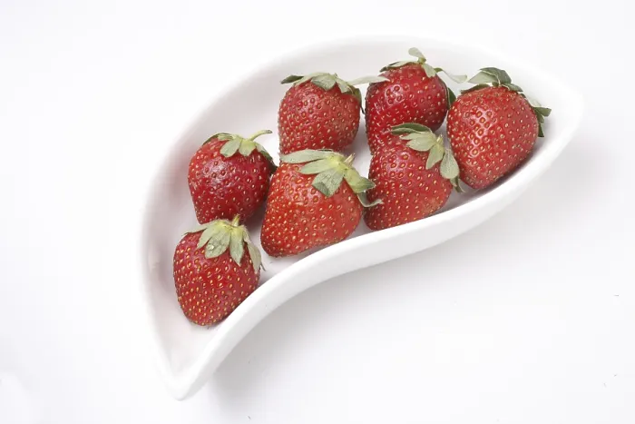 Framed Print : Fruit, Strawberry Fragaria Ananassa kept ins shaped serving tray on white background Framed Print : Fruit, Strawberry Fragaria Ananassa kept ins shaped serving tray on white background