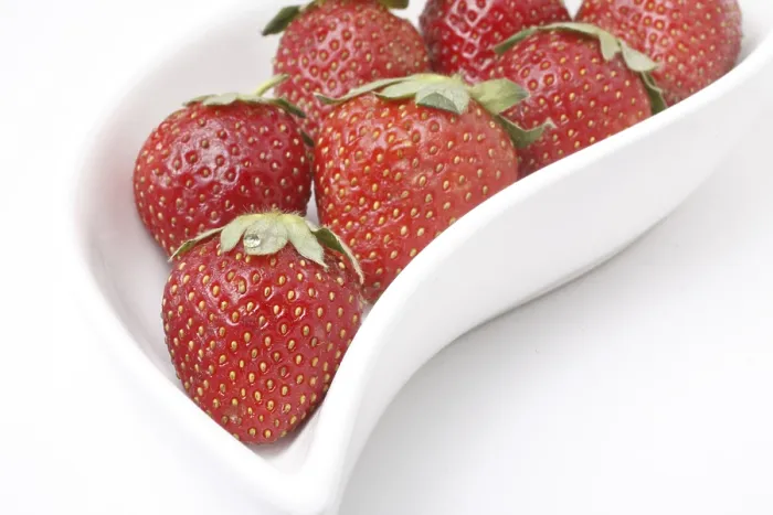 Framed Print : Fruit, Strawberry Fragaria Ananassa kept ins shaped serving tray on white background