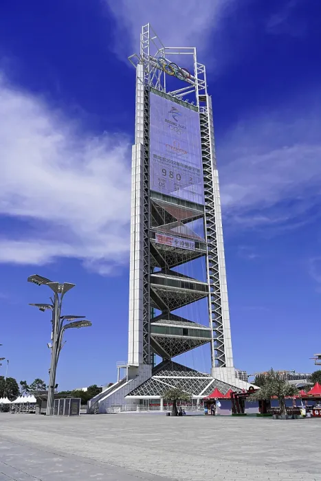 Framed Print : Futuristic tower stands imposing under clear blue sky in urban surroundings Framed Print : Futuristic tower stands imposing under clear blue sky in urban surroundings