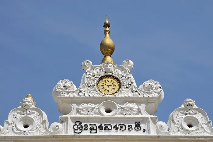 Framed Print : Gabled building with painted clock