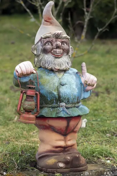 Framed Print : Garden gnome with lantern in a garden Framed Print : Garden gnome with lantern in a garden
