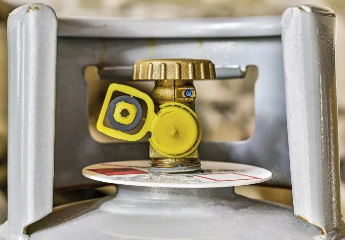 Framed Print : Gas tank valve with yellow cap and replacement gasket