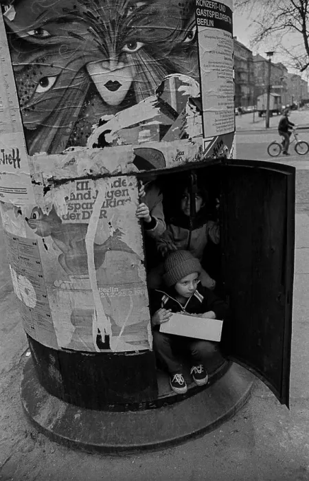 Framed Print : GDR, Berlin, 18. 03. 1989, children in an advertising pillar