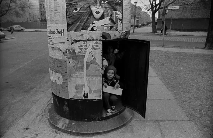 Framed Print : GDR, Berlin, 18. 03. 1989, children in an advertising pillar