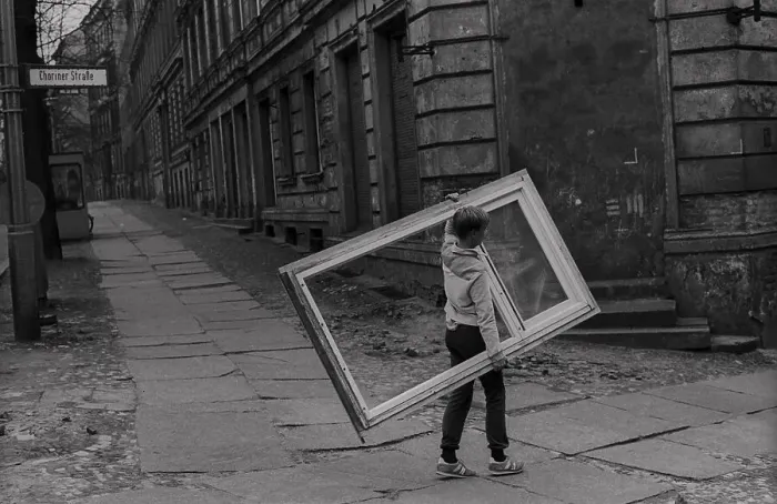 Framed Print : GDR, Berlin, 2. 4. 1988, child with window frame in Choriner Strasse Framed Print : GDR, Berlin, 2. 4. 1988, child with window frame in Choriner Strasse