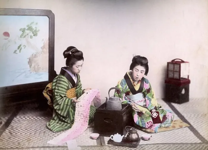 Framed Print : Two geishas reading and drinking tea, Japan, Asia Framed Print : Two geishas reading and drinking tea, Japan, Asia