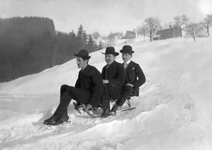 Framed Print : Three gentlemen riding a sled, historical image