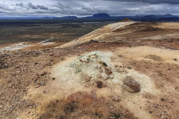 Framed Print : Geothermal field and sulphur springs in front of mountain landscape
