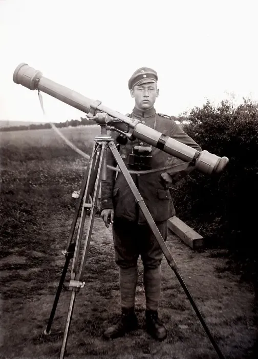 Framed Print : German soldier using a reflecting telescope to determine the firing trajectory