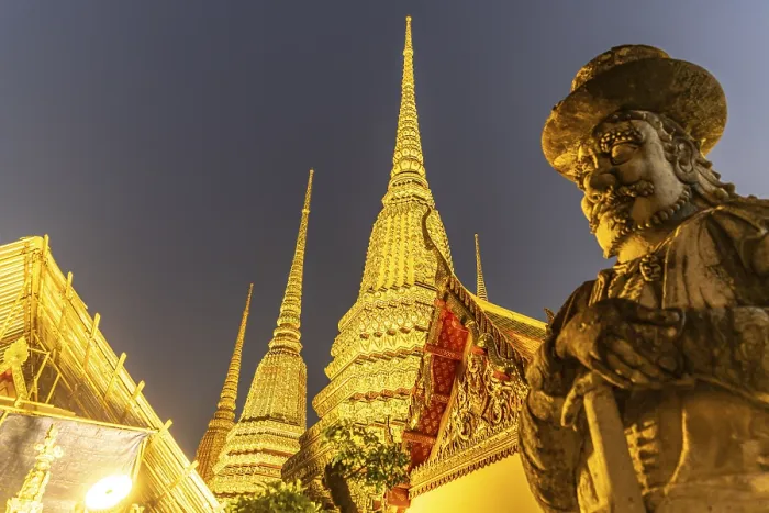 Framed Print : Giant Farang Guard and Chedi of the Buddhist temple Wat Pho at dusk Framed Print : Giant Farang Guard and Chedi of the Buddhist temple Wat Pho at dusk