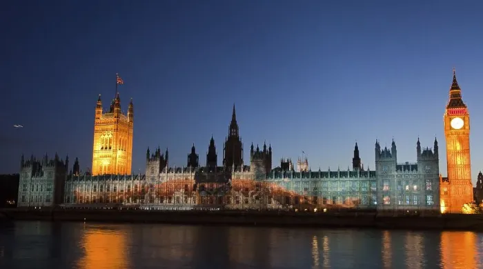 Framed Print : A giant image of US American swimmer Michael Phelps is projected onto the facade of the Houses of Parliament for
