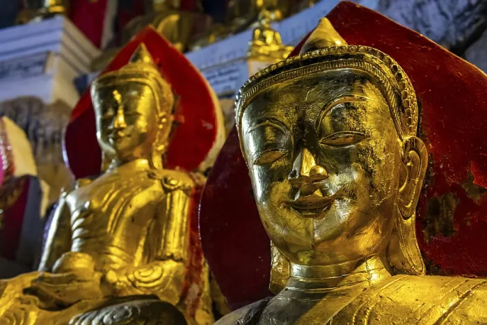 Framed Print : Gilded buddha images in the caves at Pindaya