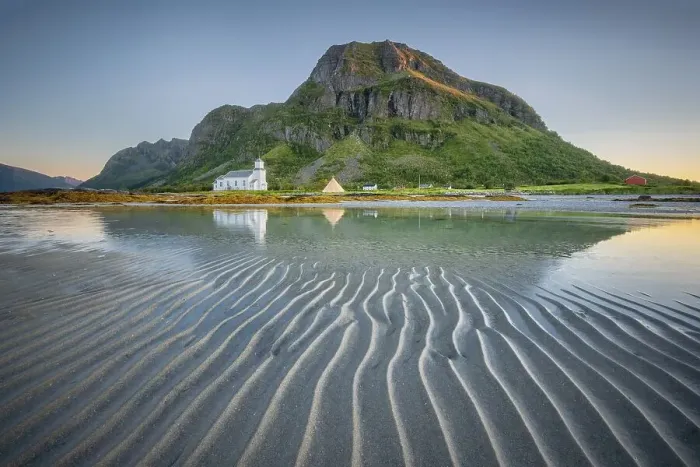 Framed Print : Gimsoy church reflected in the sea at low tide
