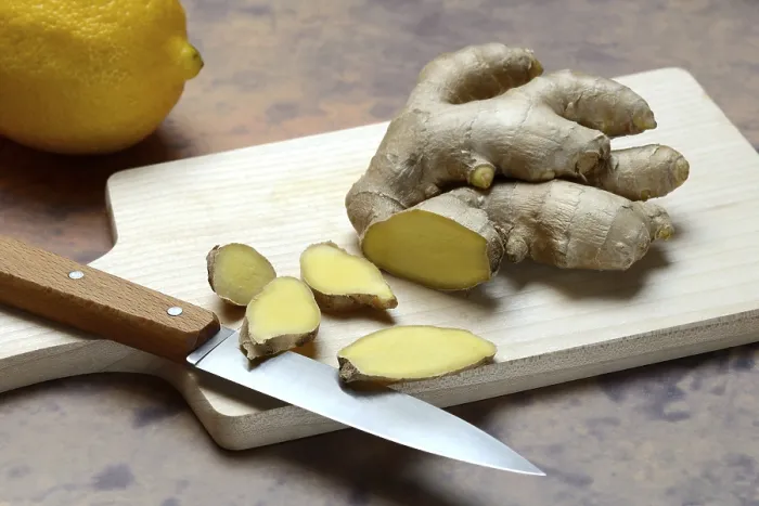 Framed Print : Ginger, ginger root cut with ginger slices on wooden boards Framed Print : Ginger, ginger root cut with ginger slices on wooden boards