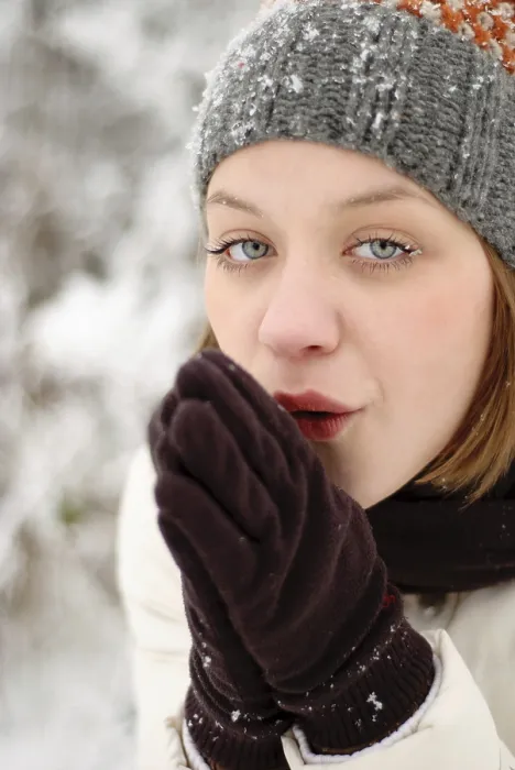 Framed Print : Girl with blue eyes warm oneself under snow outdoors
