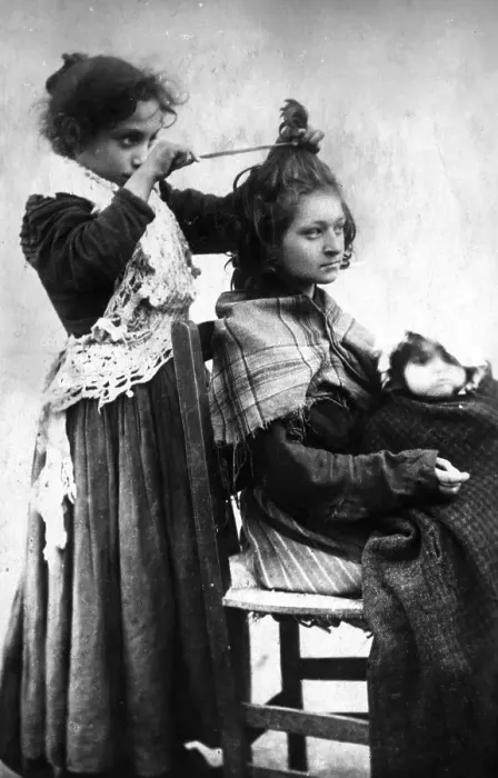 Framed Print : Girl hairdressing her girlfriend Framed Print : Girl hairdressing her girlfriend