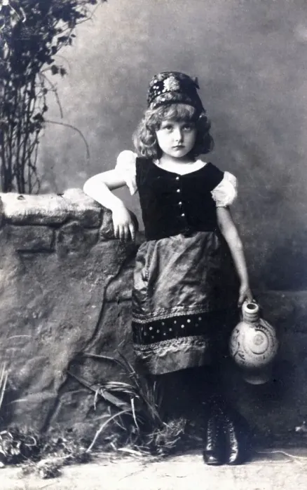 Framed Print : Girl in historic costume with a crock postcard about 1900 Framed Print : Girl in historic costume with a crock postcard about 1900