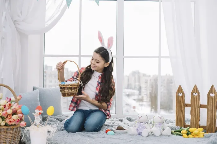 Framed Print : Girl sitting bed looking easter eggs basket home