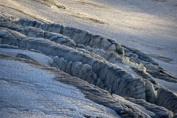 Framed Print : Glacier ice with crevasses in the evening light