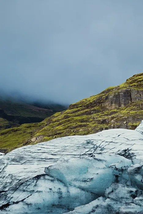 Framed Print : Glacier with misty mountains and lush green hills in the background