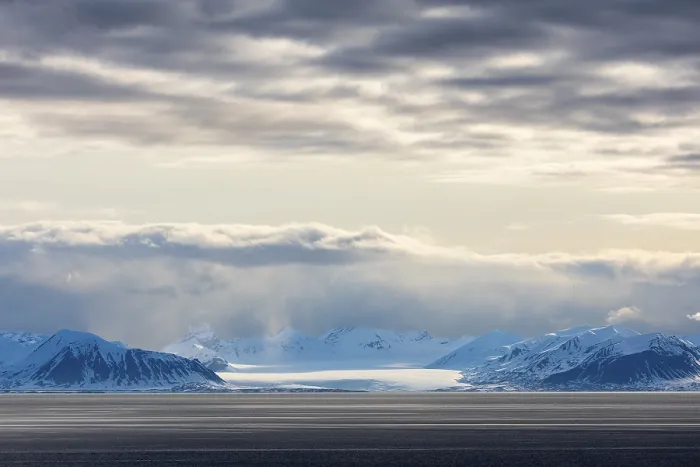 Framed Print : Glaciers between snow-capped mountains at sea Framed Print : Glaciers between snow-capped mountains at sea