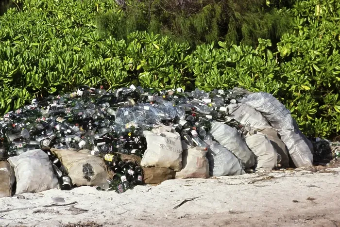Framed Print : Glass bottles collected on the beach, environmental clean-up, Seychelles 1980