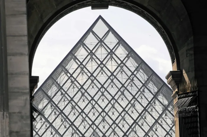 Framed Print : Glass pyramid of the Louvre, modern architectural landmark with a dramatic presence