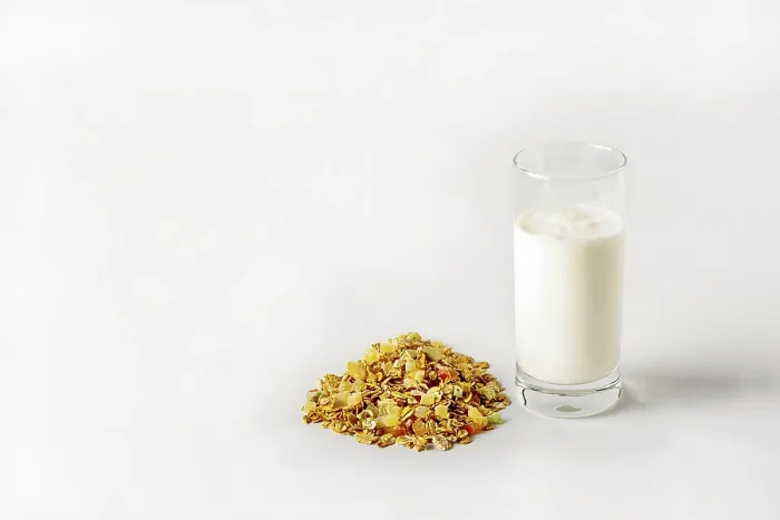 Framed Print : A glass of yogurt and a bunch of muesli on a white background Framed Print : A glass of yogurt and a bunch of muesli on a white background
