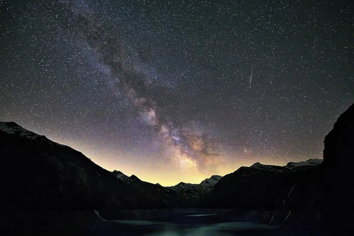Framed Print : Glittering Milky Way stretches over the mountain range