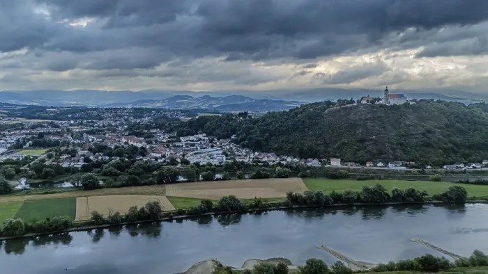 Framed Print : Gloomy clouds drift over the picturesque landscape with the Danube and the Bogenberg
