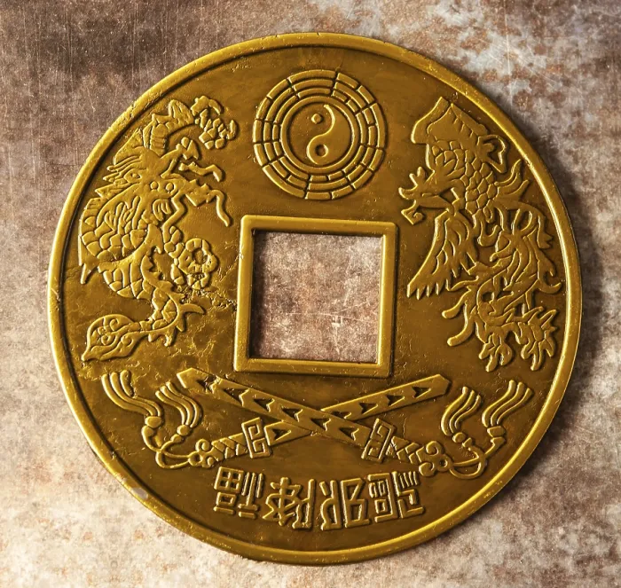 Framed Print : A gold coin features a dragon and tiger with a yin yang symbol