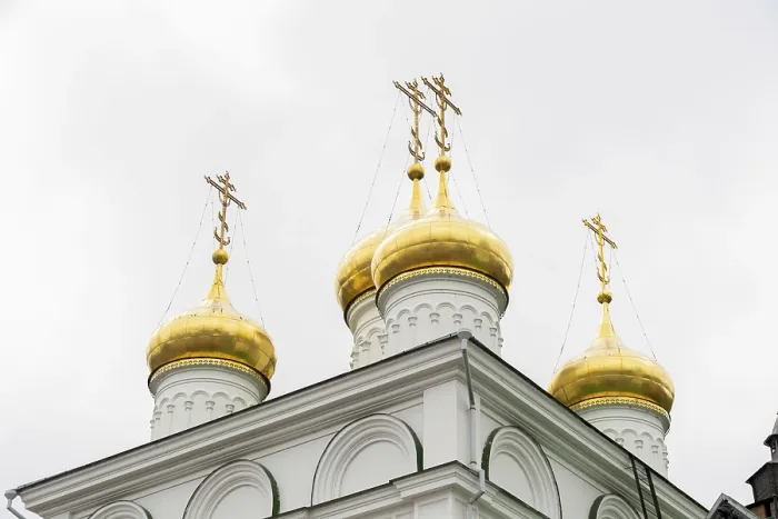 Framed Print : Golden domes on a white church