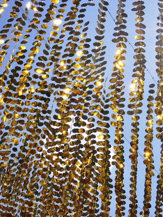 Framed Print : Golden garlands shine in the sun as a background