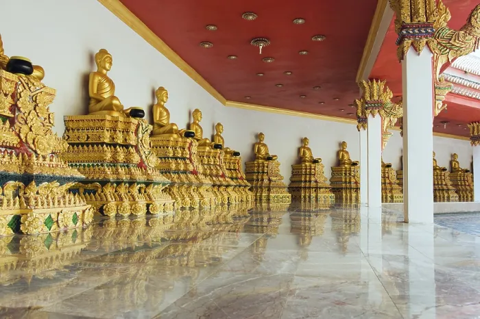 Framed Print : Golden statues of Buddha in a mountain temple