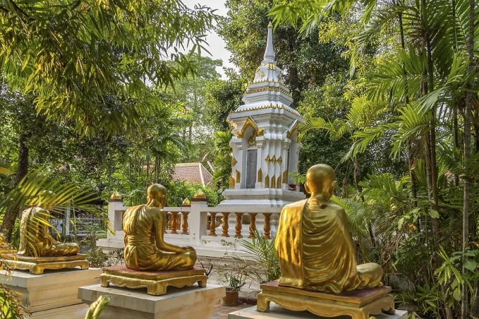 Framed Print : Golden statues of monks in the garden of the Buddhist temple complex Wat Phra Singh Framed Print : Golden statues of monks in the garden of the Buddhist temple complex Wat Phra Singh