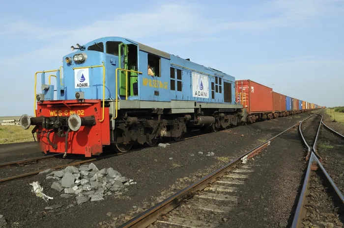 Framed Print : Goods containers with train engine at Adani Power