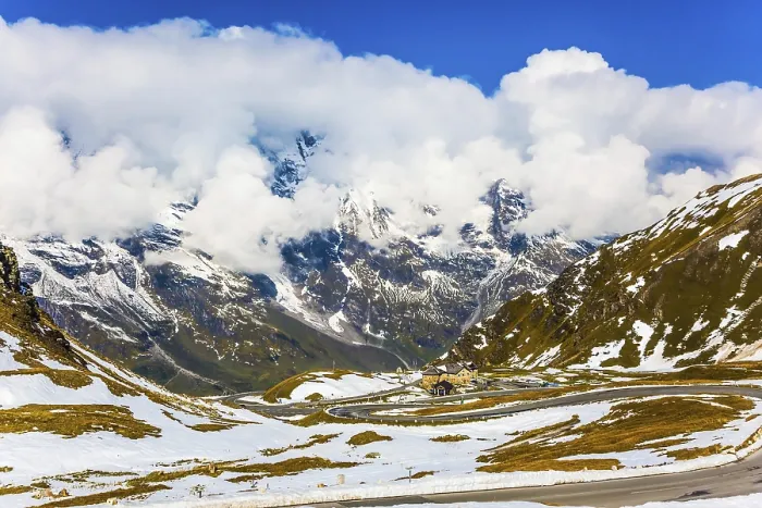 Framed Print : Grand Austrian Alps. The snow on the mountainside began to melt