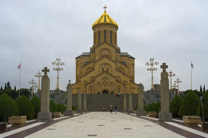 Framed Print : Grand cathedral with golden roof and stylish stone pillars against cloudy sky