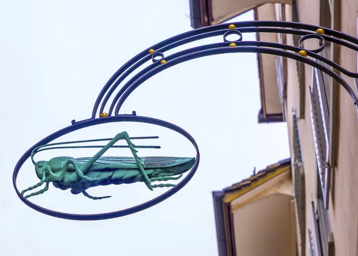 Framed Print : Grasshopper Symbol on a Sign in Switzerland