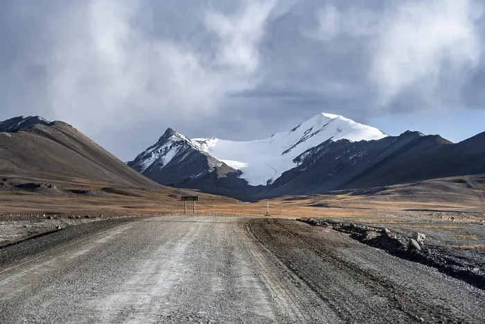 Framed Print : Gravel road through autumnal plateau