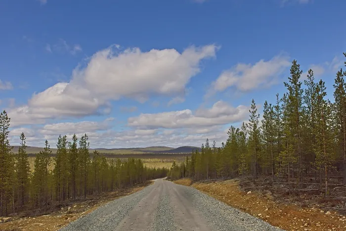Framed Print : A gravel road landscape at Raja-Jooseppi in spring with clouds in the sky