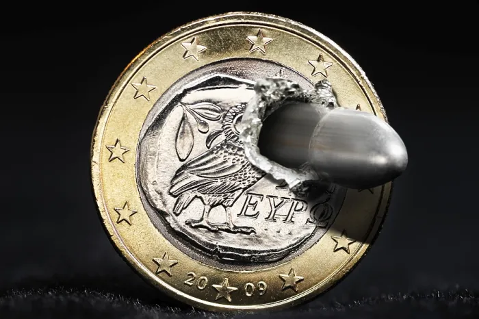 Framed Print : Greek euro is shot through with bullet