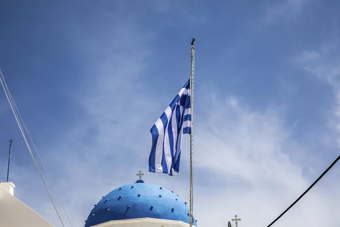 Framed Print : Greek flag waving in the wind, blue church dome