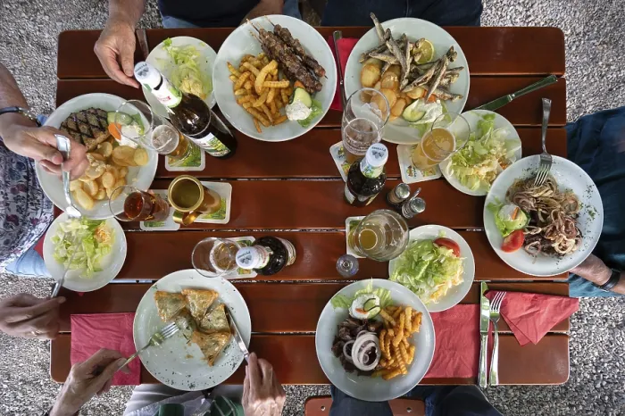 Framed Print : Greek food served on a table in a beer garden