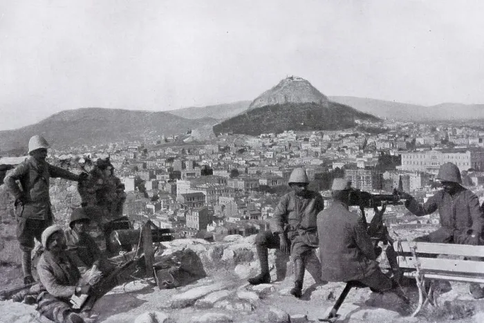 Framed Print : Greek soldiers stationed on the Acropolis with a canon and a machine gun in front of the Lycabettus mount